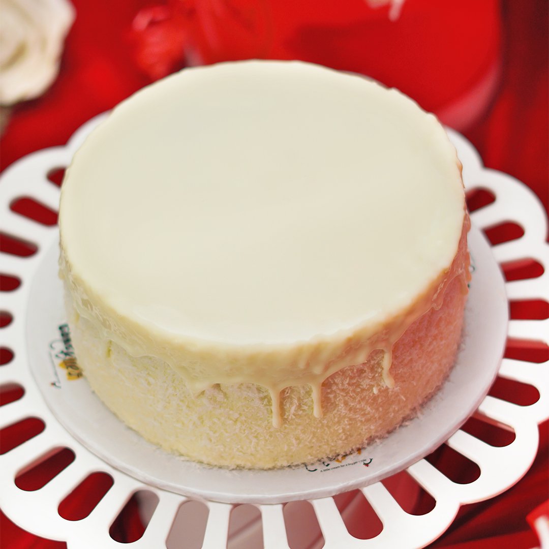 Raffaello Cake by CakeBites with white chocolate and coconut topping