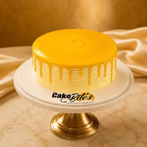 Three Milk Mango Cake 2.5 lbs medium size by Cakebites.pk with glossy mango glaze and cream ridges